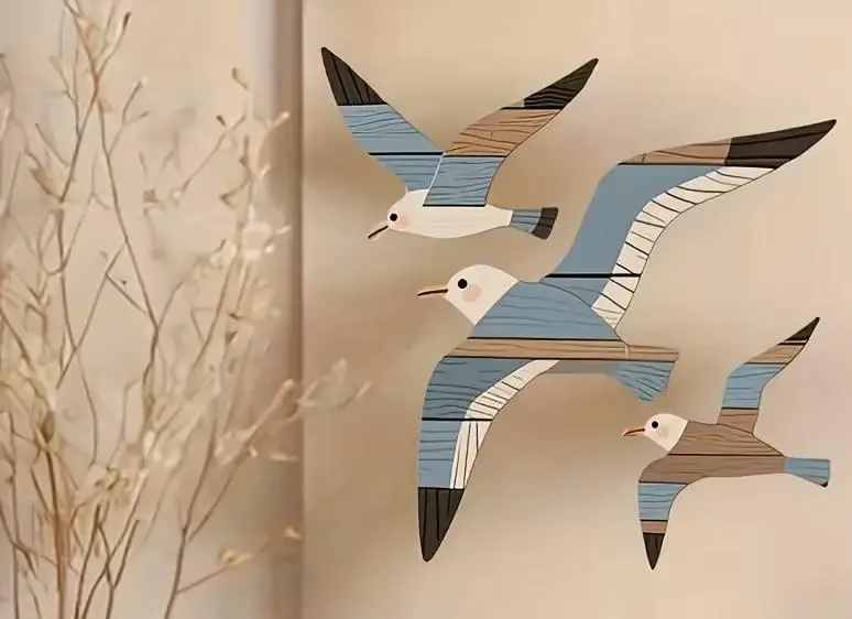 3 wooden seagull wall art pieces for coastal themed BnB room